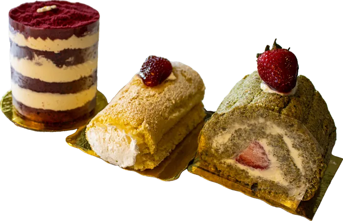 Assorted dessert slices and a layered cup