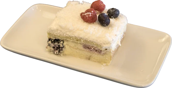 Coconut cake slice with berries