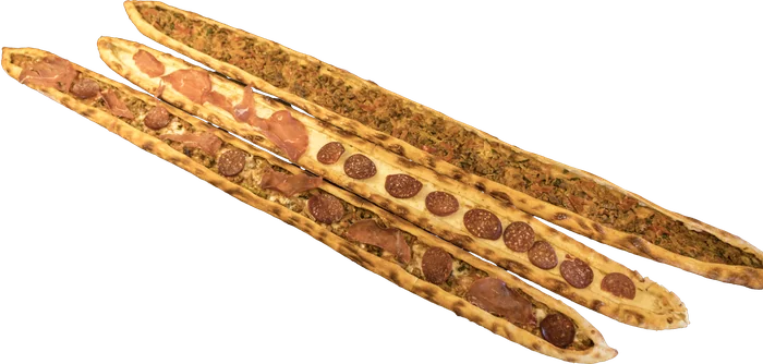 Three Turkish pide with mixed toppings