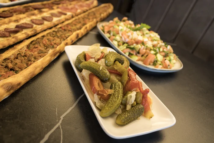 Close-up of pide with side dishes